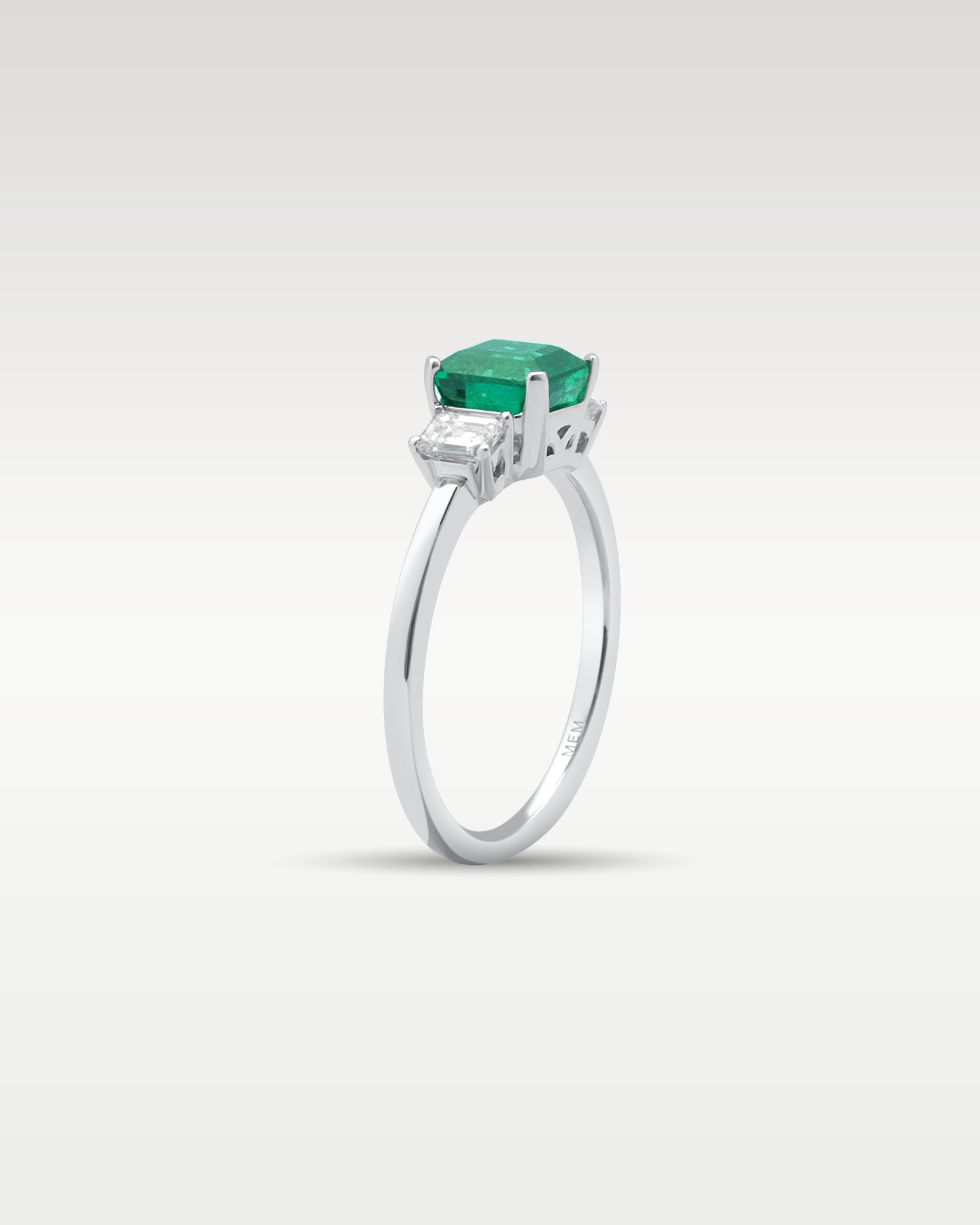 Platinum Three Stone Emerald and Diamond Ring | Noah's Fine Jewelry Dallas