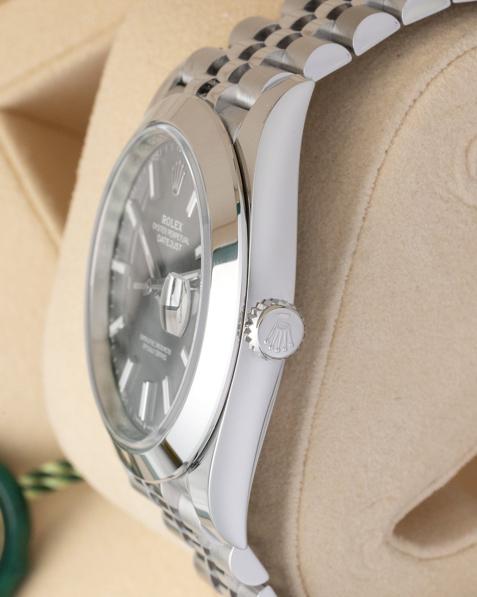Side profile view of Rolex Datejust 41 126300 showing Twinlock screw-down winding crown and smooth bezel