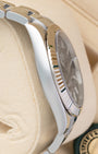 Polished Oystersteel case side profile and fluted gold bezel view of pre-owned Rolex Datejust 41 reference 126334