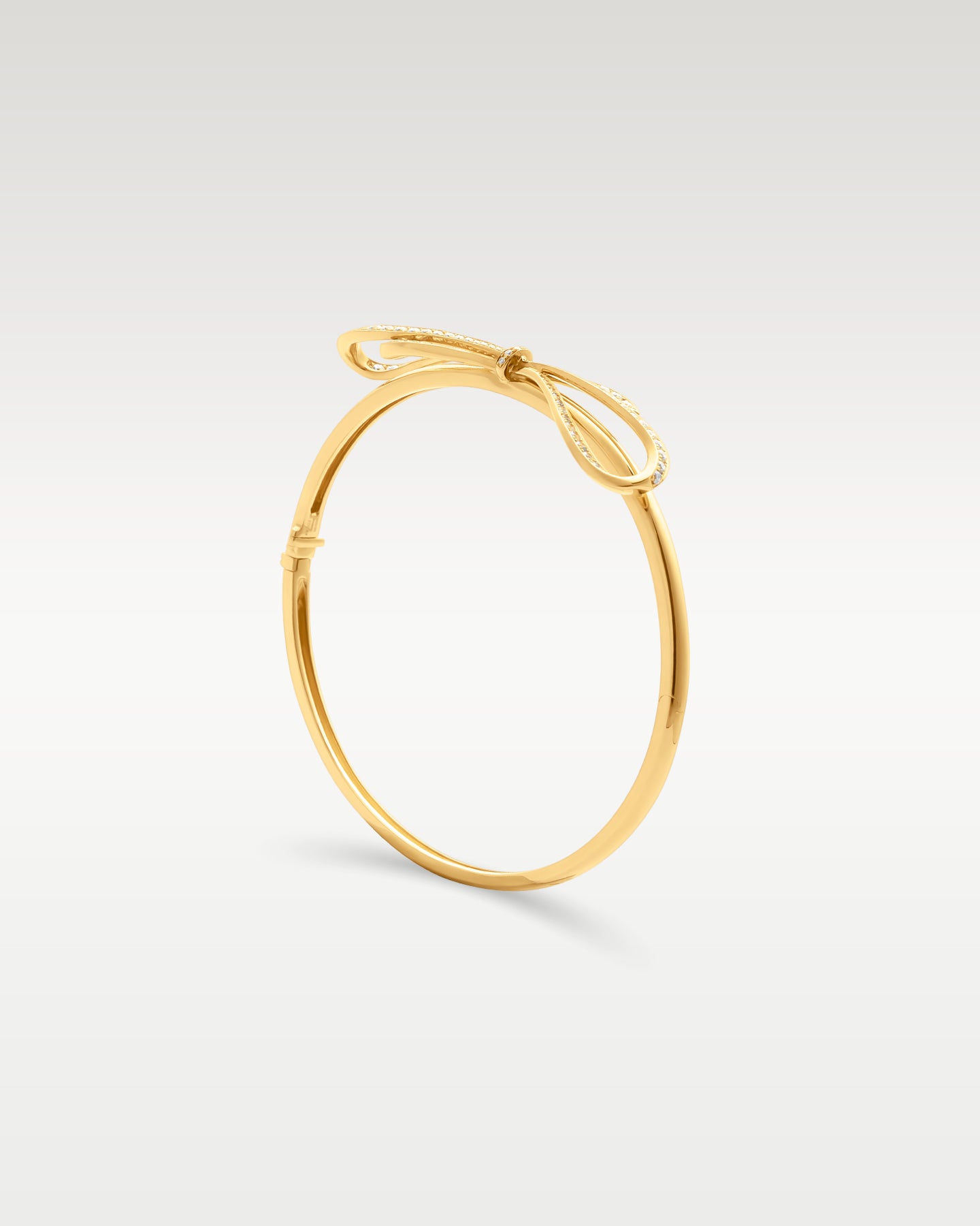 Yellow Gold Diamond Bow Bangle | Noah's Fine Jewelry Frisco, Texas