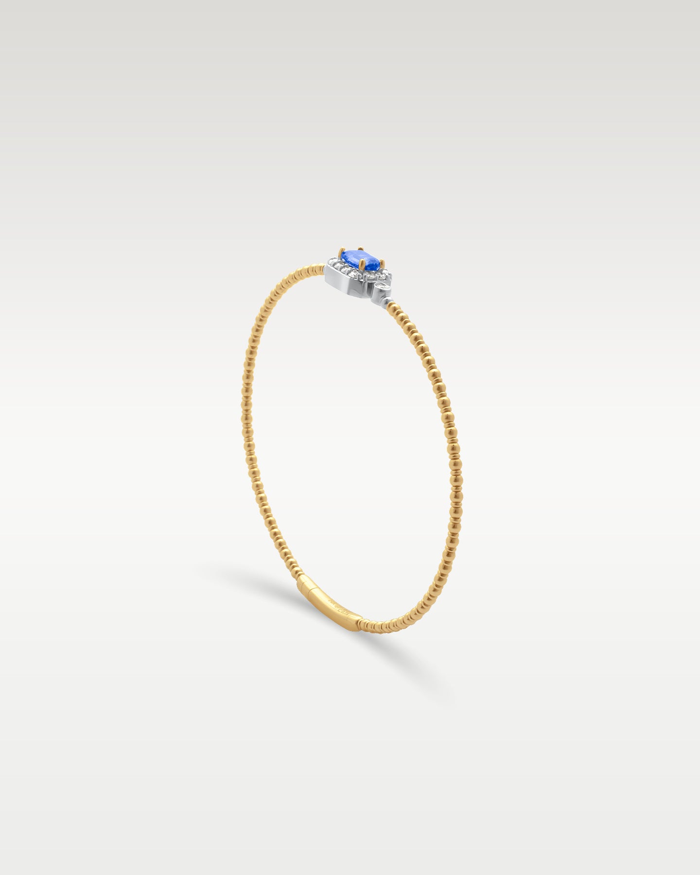 Gold Sapphire Diamond Flex Bangle Bracelet | Noah's Fine Jewelry and Watches Dallas