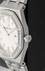 Close-up right profile view of the 33mm AP Royal Oak case highlighting the factory diamond-set octagonal bezel and hexagonal winding crown