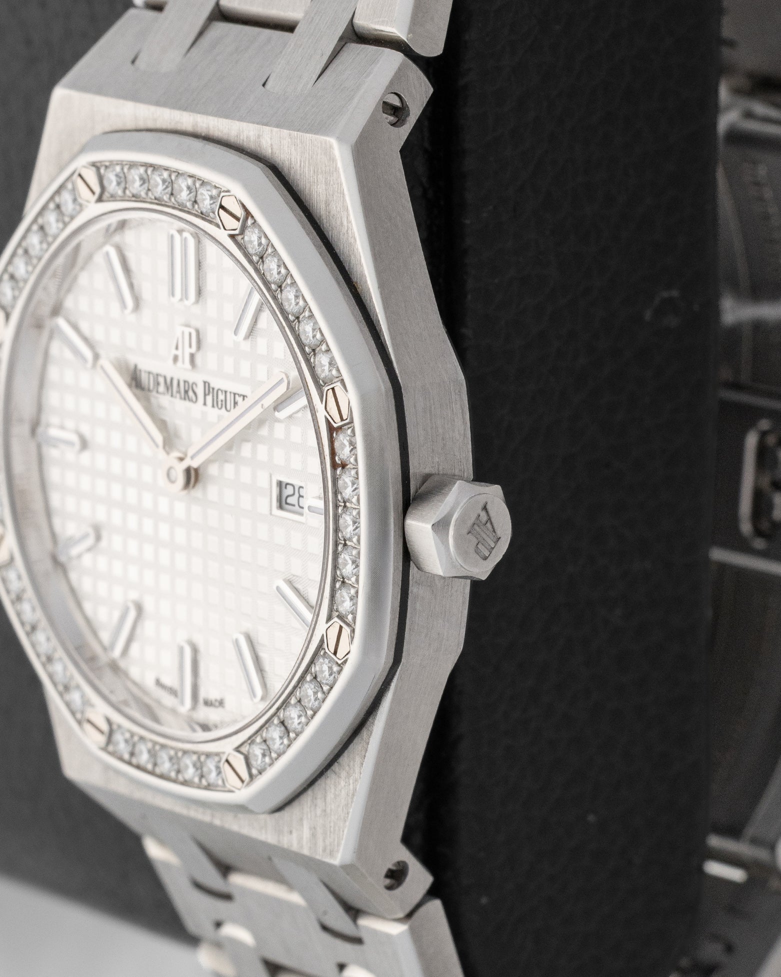 Close-up right profile view of the 33mm AP Royal Oak case highlighting the factory diamond-set octagonal bezel and hexagonal winding crown