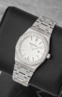 angled top-down studio overview of the stainless steel 33mm Audemars Piguet Royal Oak watch showing its integrated steel bracelet and textured silver dial
