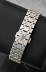 rear snapshot focusing on the brushed stainless steel integrated Royal Oak bracelet and the folding clasp featuring the engraved AP logo
