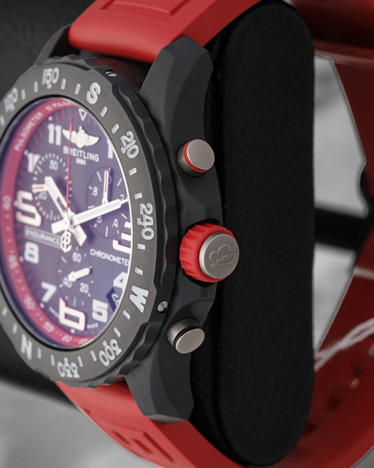 Side profile focus on the non-magnetic Breitlight polymer case construction, red-molded winding crown, and tactile chronograph pushers