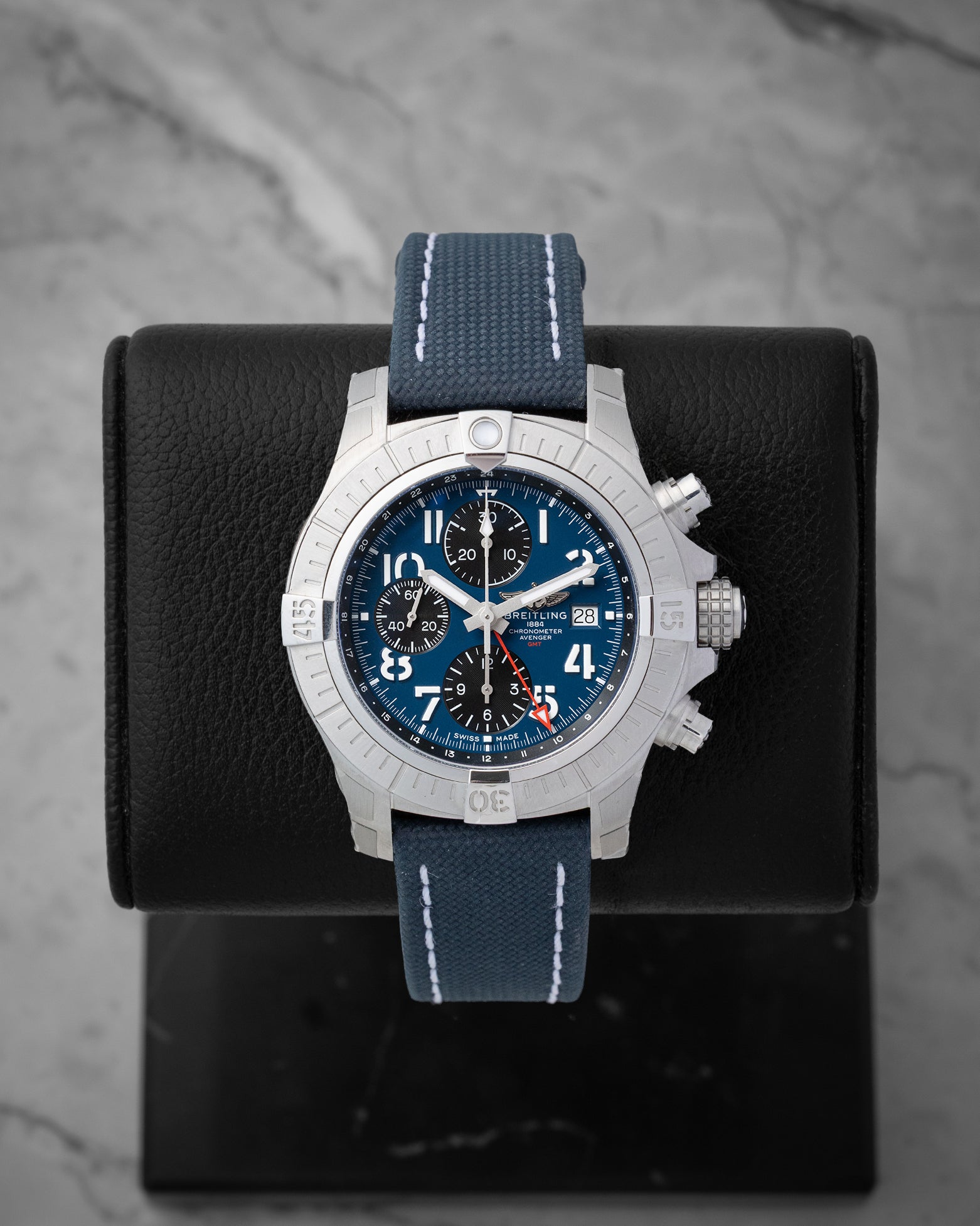 Pre owned Breitling Avenger Chronograph GMT 45mm reference A24315101C1X1 with blue dial and blue military leather strap at Noahs Fine Watches and Jewelry in Dallas TX