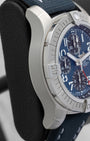 Left side profile view highlighting the satin-brushed stainless steel case and rider tabs on a preowned Breitling Avenger GMT reference A24315101C1X1