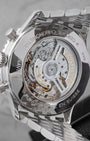 The sapphire crystal exhibition caseback of a Breitling Navitimer showcasing the column-wheel Manufacture Caliber B01 automatic movement
