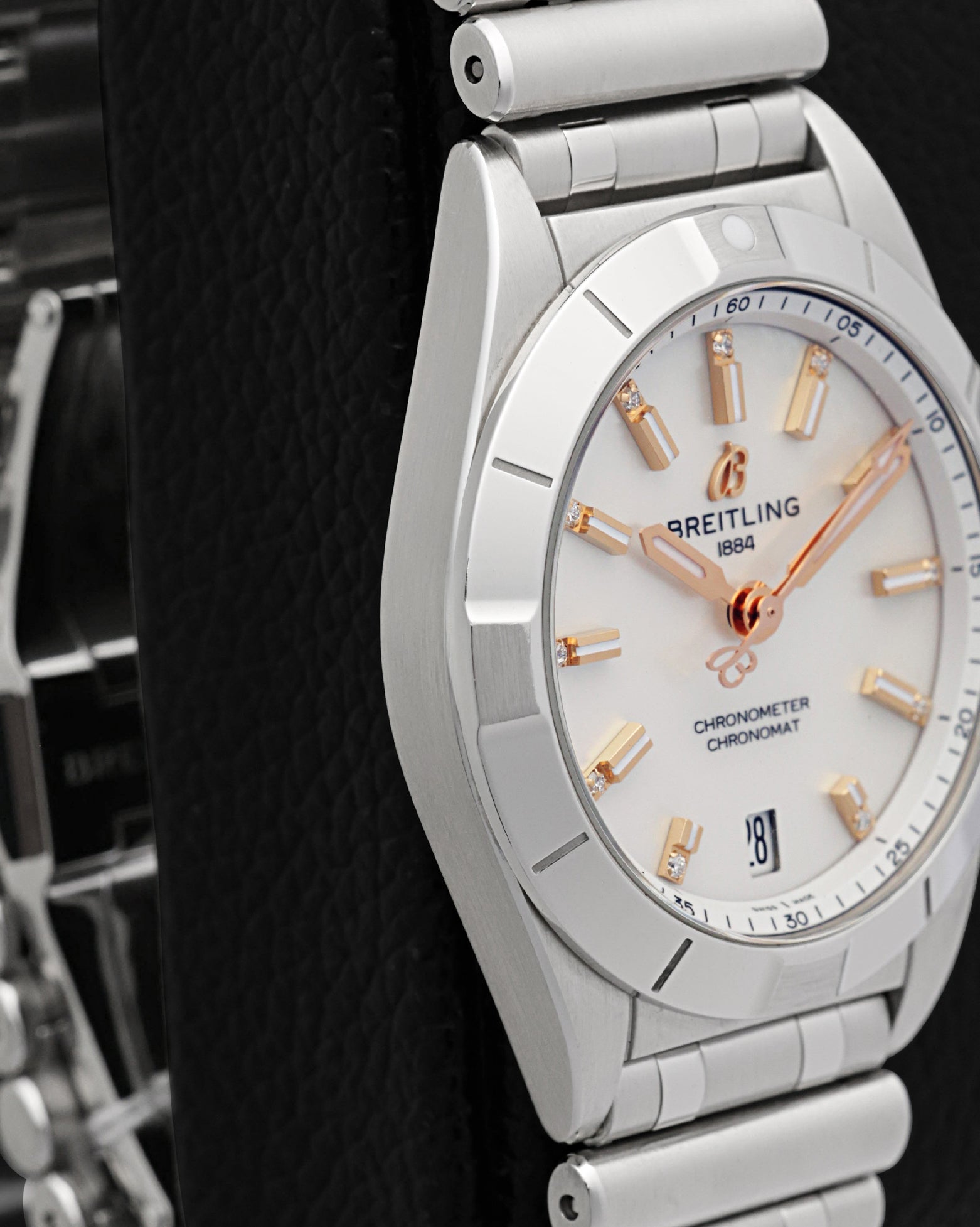 Left-side studio profile view showcasing the fine satin-brushed finish across the watch case band and the clean architectural curve of the lugs