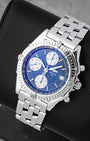 Front angled view of a stainless steel Breitling Chronomat 39mm blue dial luxury pilot watch in Dallas