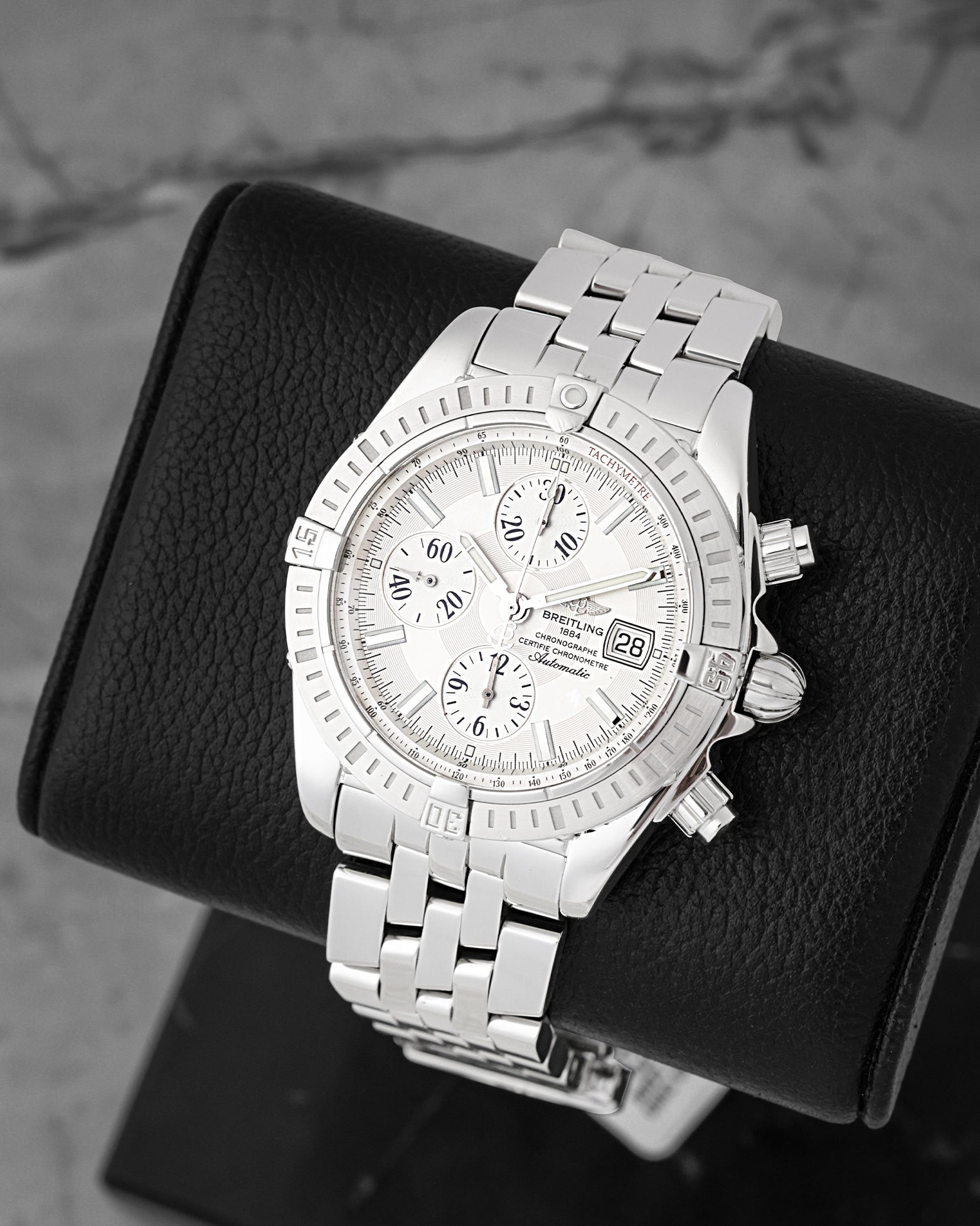 front view of Breitling Chronomat Evolution A13356 showing silver sub-dials, rider tab bezel, and Pilot bracelet