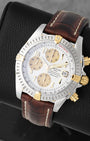 view of Breitling Chronomat Evolution B13356 featuring 18k yellow gold rider tabs, gold subdials, and brown leather strap