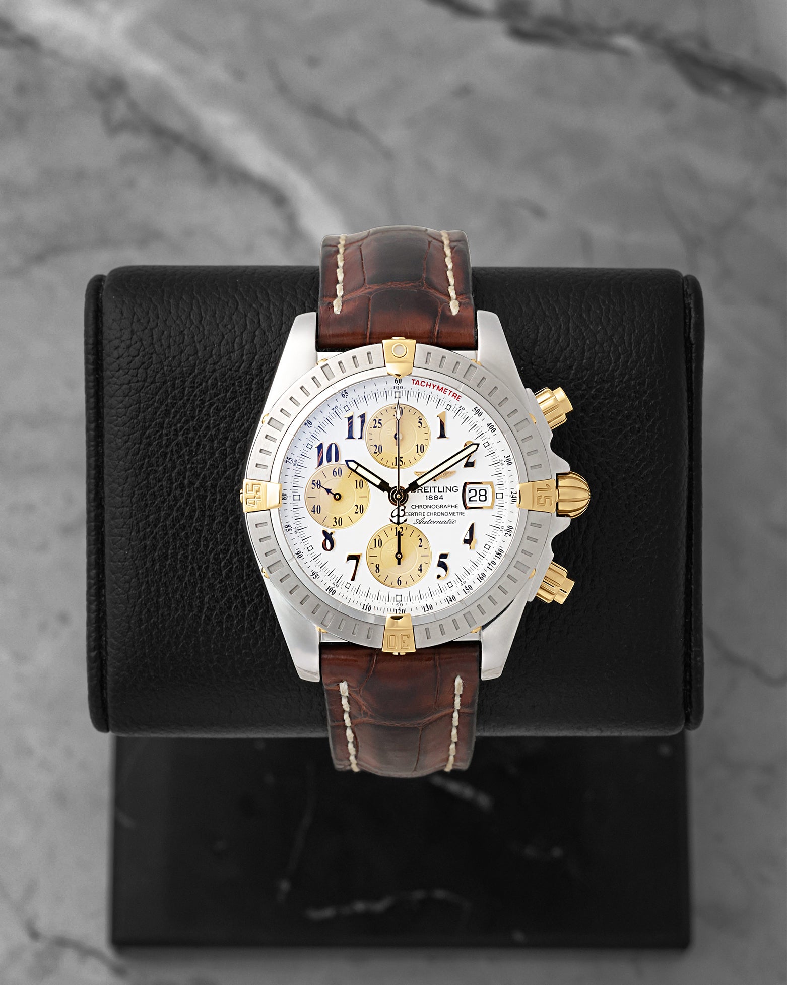 Preowned two-tone Breitling Chronomat Evolution B13356 silver dial watch at Noah's Fine Watches & Jewelry in Dallas, TX