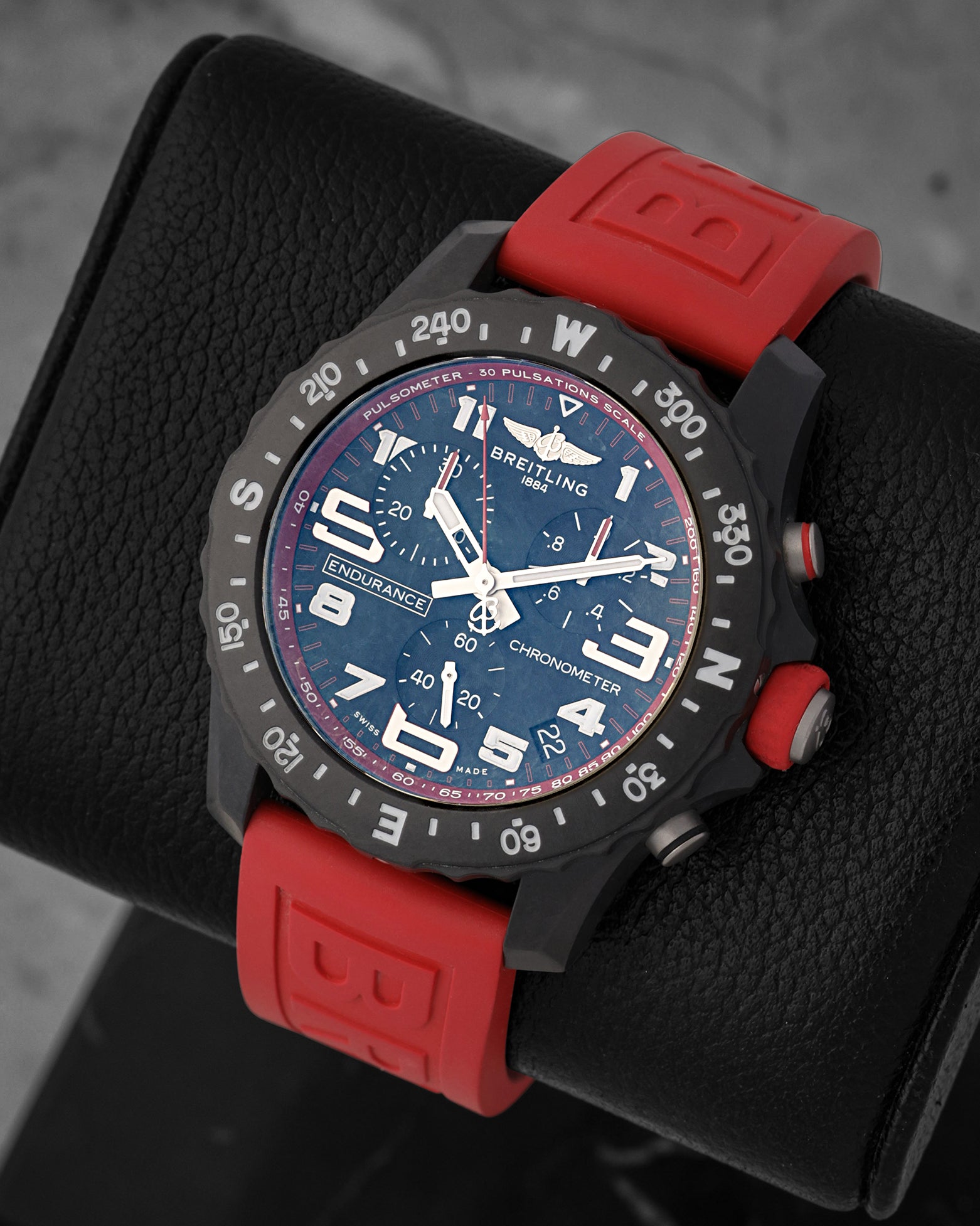 Angled front view of Breitling Endurance Pro 44 Breitlight case with red pulsometer ring