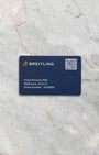 The official blue Breitling electronic international warranty card with QR code, confirming product authenticity at Noahs Fine Watches and Jewelry Dallas