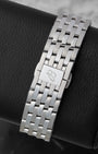 Back view showing the 7-row stainless steel Navitimer bracelet with butterfly folding clasp engraved with the Breitling B logo on reference A17329