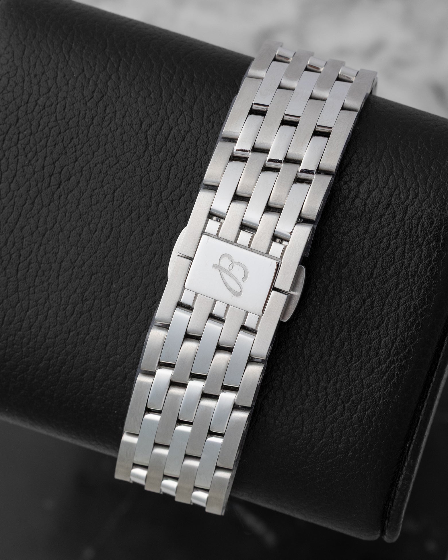 Back view showing the 7-row stainless steel Navitimer bracelet with butterfly folding clasp engraved with the Breitling B logo on reference A17329