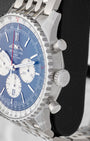 Side profile view of the stainless steel case showing the fluted slide rule bezel, main crown, and piston chronograph pushers