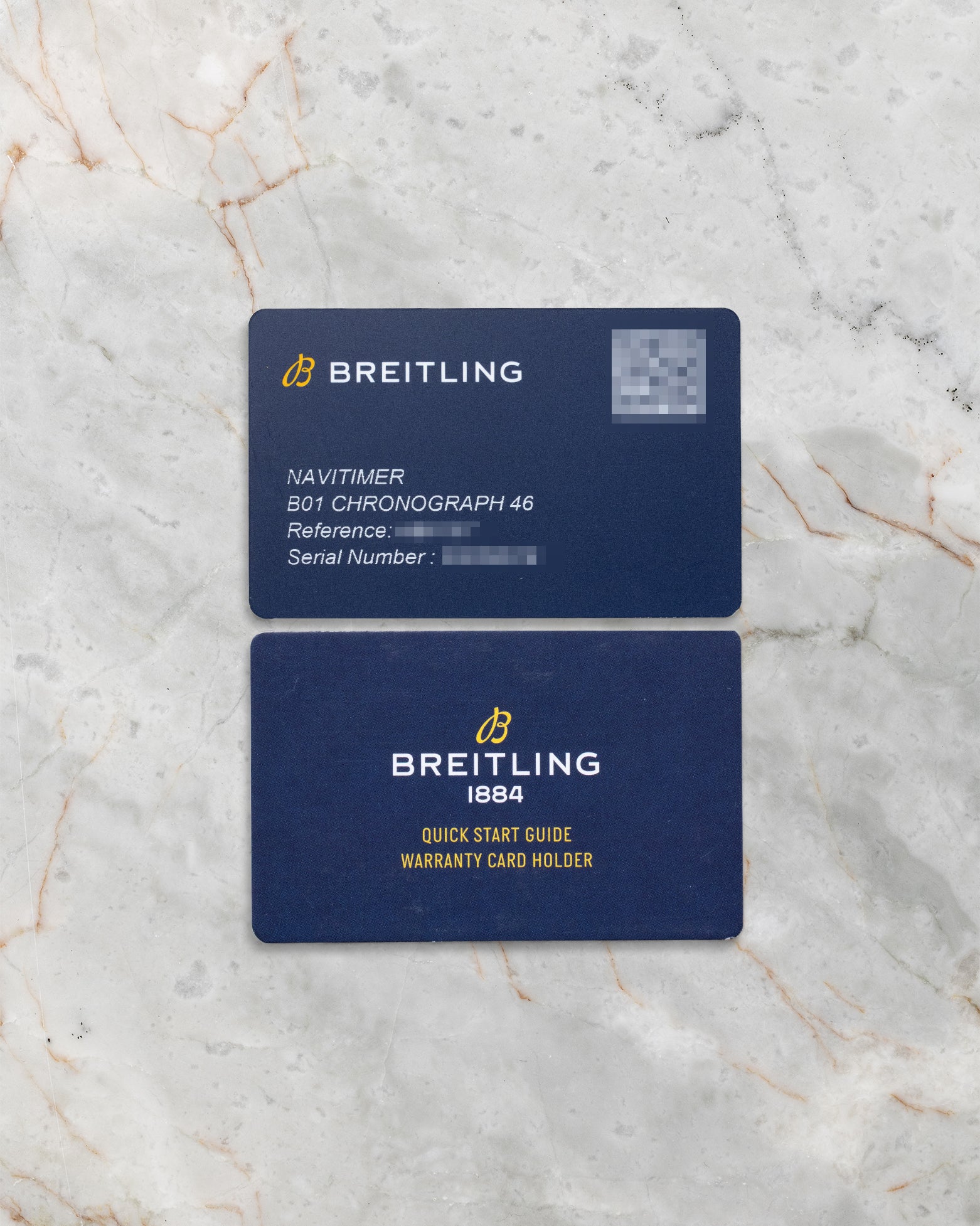 The official modern Breitling QR code smart warranty card and electronic documentation kit displayed on a marble background