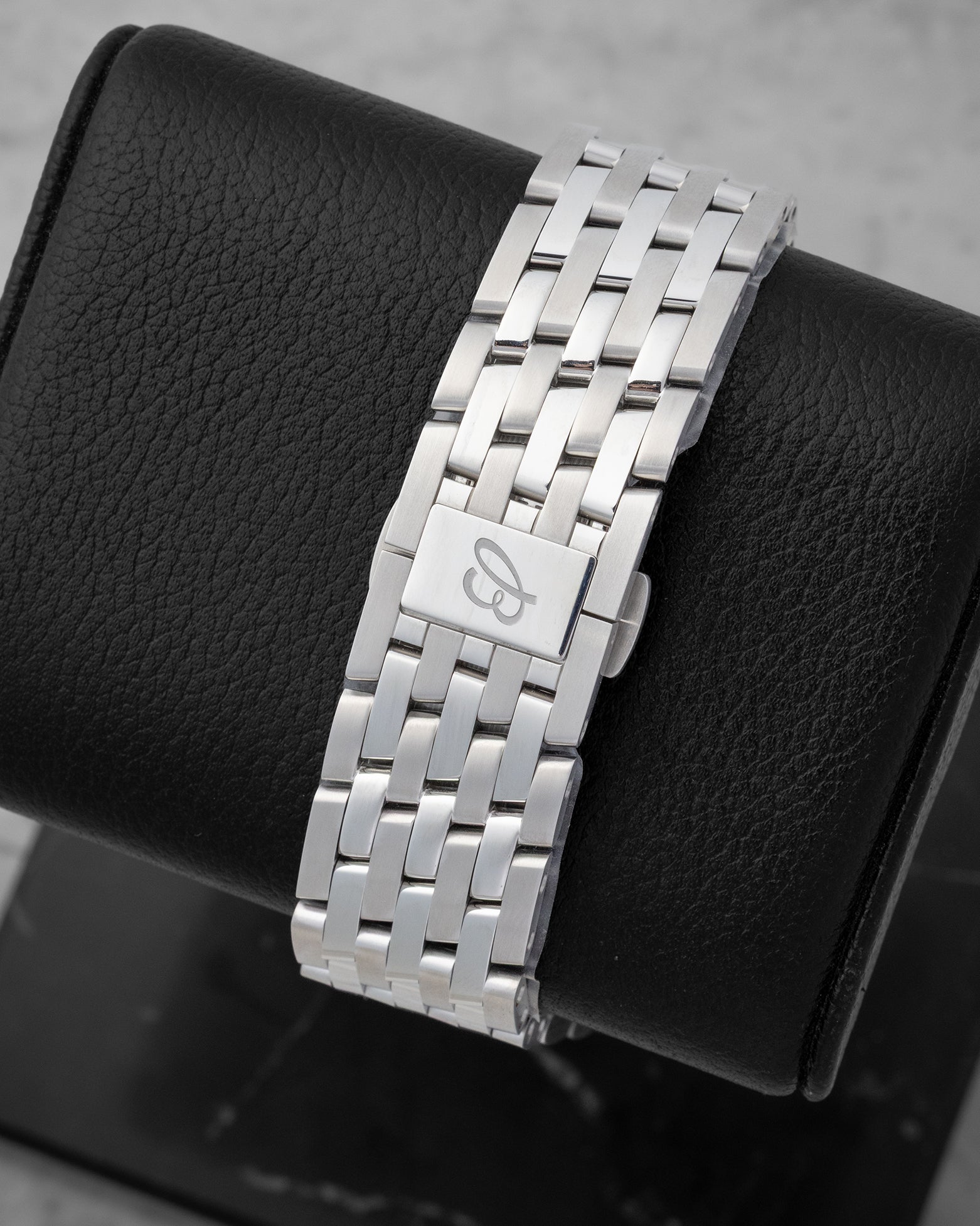 Rear studio view of the iconic 7-row stainless steel Navitimer link bracelet and integrated folding deployment clasp