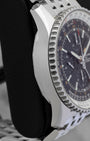 Left side profile view of the polished stainless steel case and slide rule bezel edge on a Breitling Navitimer World GMT reference A24322