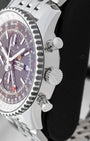 Side profile showing the 46mm stainless steel case, signed winding crown, and chronograph pushers on a Breitling Navitimer World A24322