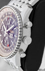 Side profile showing the 46mm stainless steel case, signed winding crown, and chronograph pushers on a Breitling Navitimer World A2432212