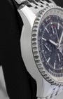 Left side profile view of the polished stainless steel case and slide rule bezel edge on a Breitling Navitimer World GMT reference A2432212