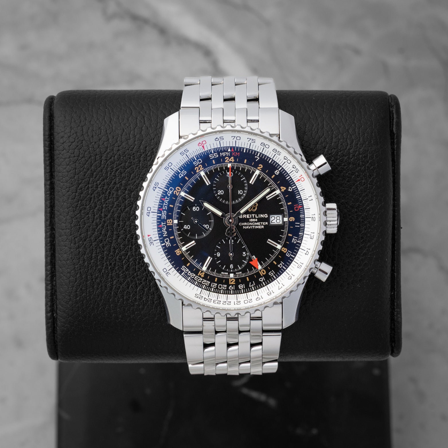 Pre owned Breitling Navitimer World GMT 46mm reference A24322 with black dial and stainless steel Navitimer bracelet at Noahs Fine Watches and Jewelry in Dallas TX
