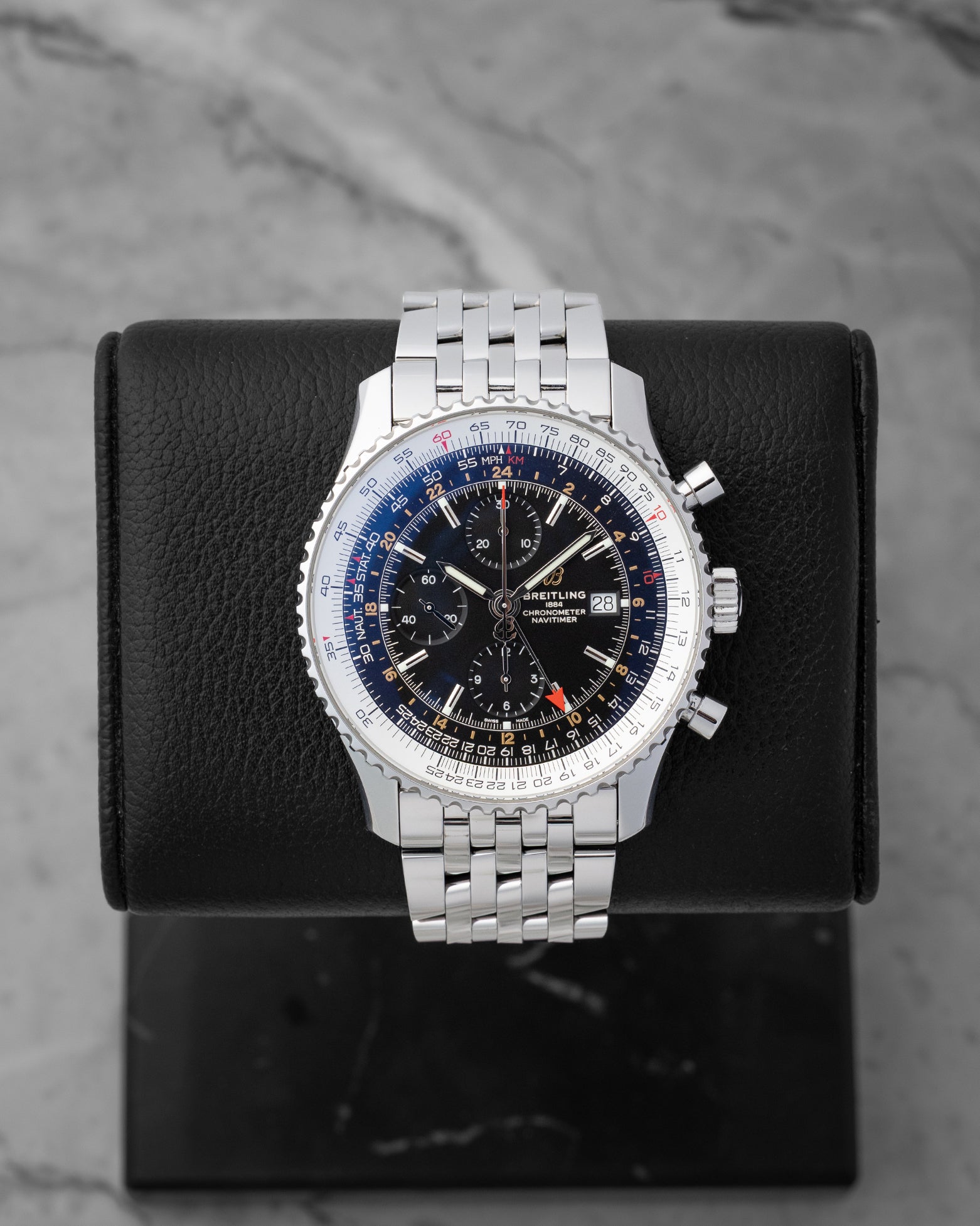 Pre owned Breitling Navitimer World GMT 46mm reference A24322 with black dial and stainless steel Navitimer bracelet at Noahs Fine Watches and Jewelry in Dallas TX