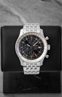Preowned Breitling Navitimer World GMT Chronograph 46mm reference A2432212 with black dial and stainless steel Navitimer bracelet at Noahs Fine Watches and Jewelry in Dallas TX