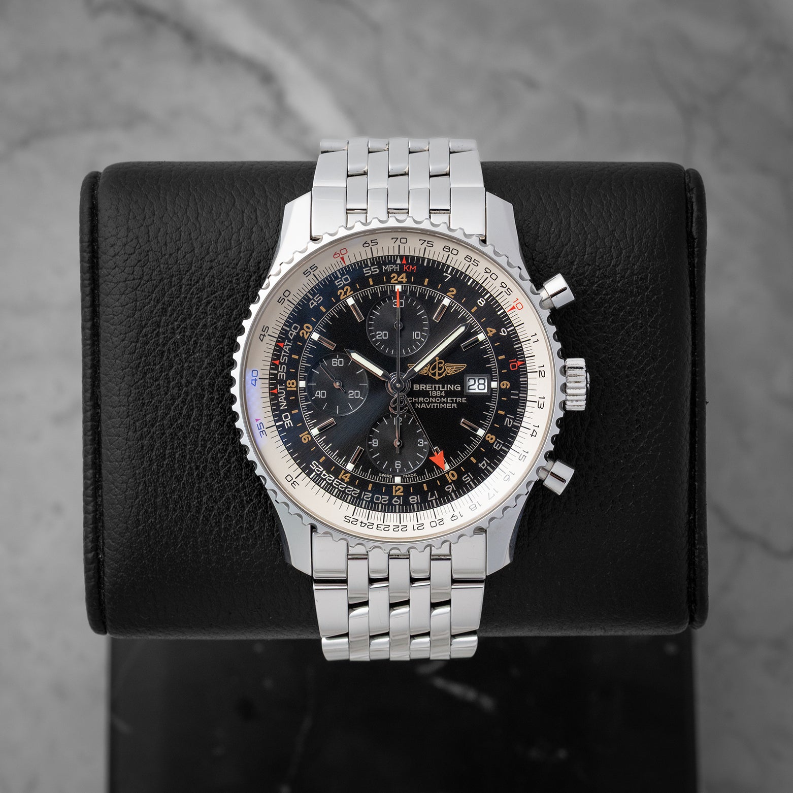 Preowned Breitling Navitimer World GMT Chronograph 46mm reference A2432212 with black dial and stainless steel Navitimer bracelet at Noahs Fine Watches and Jewelry in Dallas TX