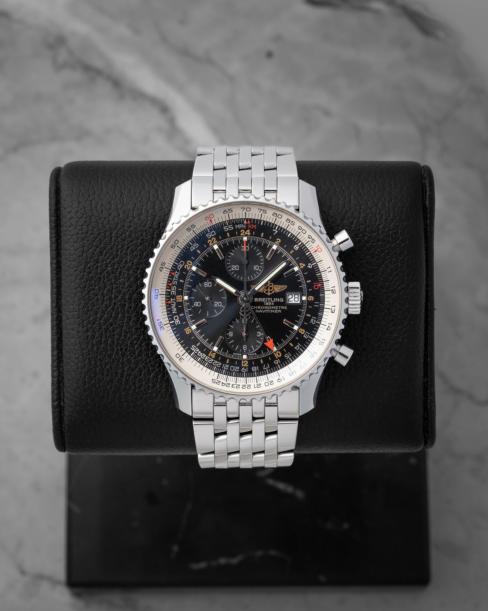 Preowned Breitling Navitimer World GMT Chronograph 46mm reference A2432212 with black dial and stainless steel Navitimer bracelet at Noahs Fine Watches and Jewelry in Dallas TX