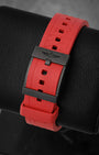 Rear perspective of the red Diver Pro rubber strap secured with a black Breitlight polymer tang buckle featuring the signature Breitling wing logo