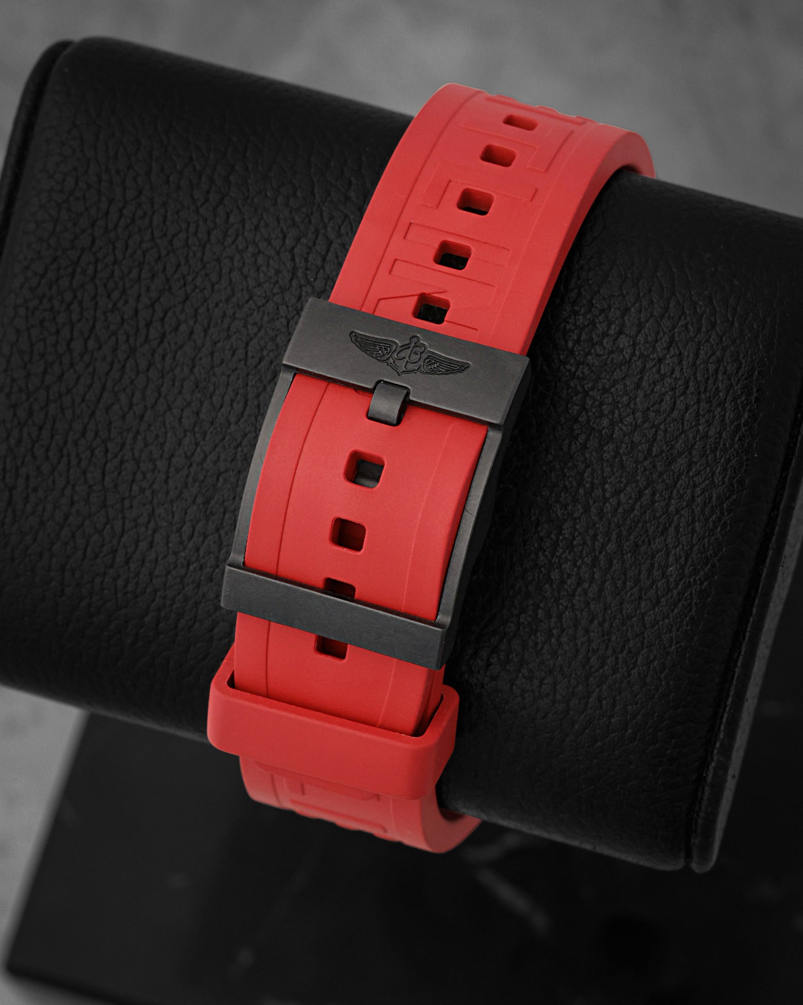 Rear perspective of the red Diver Pro rubber strap secured with a black Breitlight polymer tang buckle featuring the signature Breitling wing logo