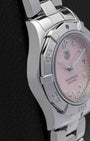 left side profile of the 27mm stainless steel case on a ladies TAG Heuer Aquaracer resting on a leather display cushion