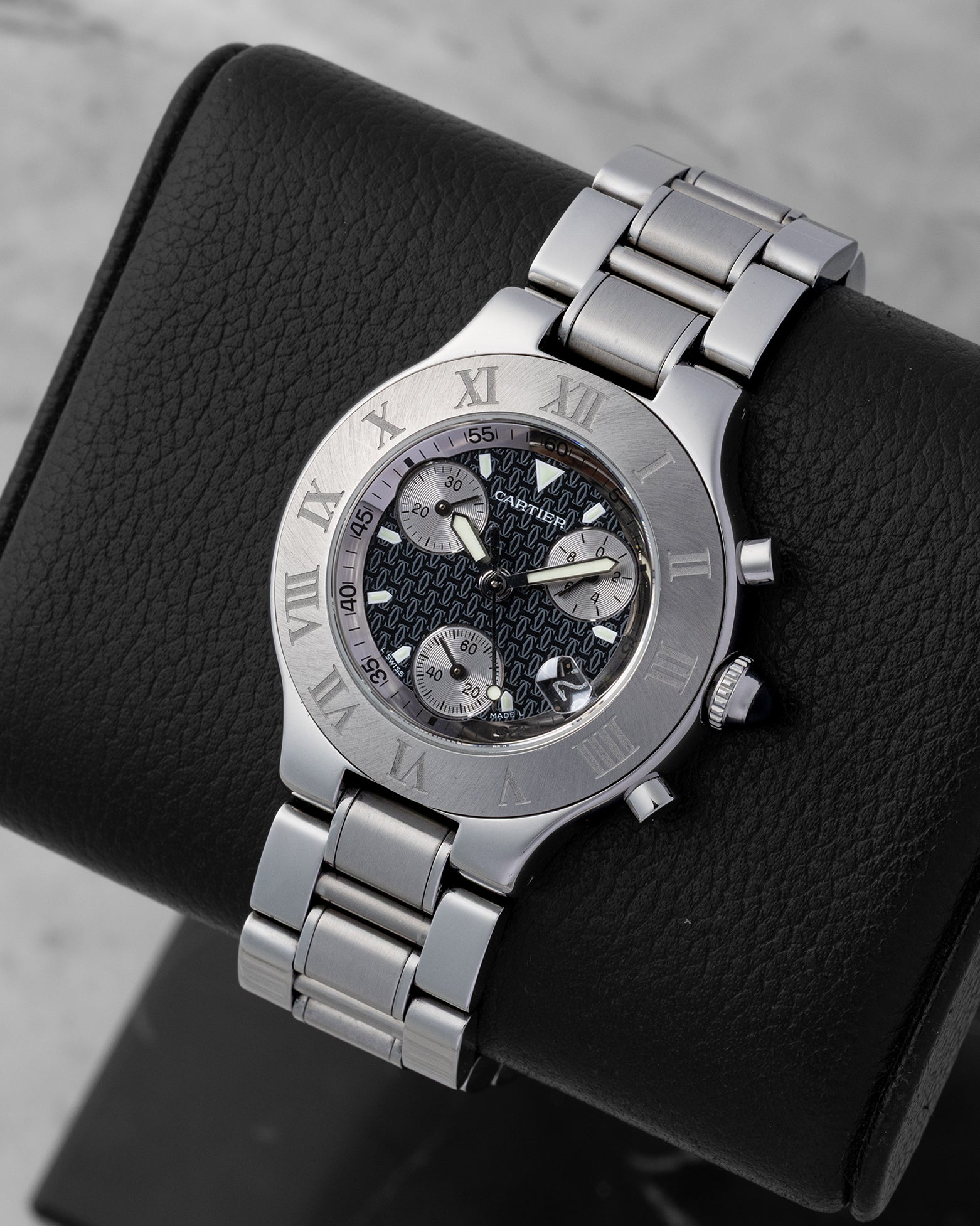 Angled collector view of a 38mm Cartier Chronoscaph 21 luxury sports watch highlighting the distinctive steel case and integrated silver sub-dials under a sapphire crystal