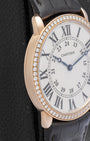 Left profile view of the ultra-thin 18k rose gold case on a Cartier Ronde Louis luxury watch
