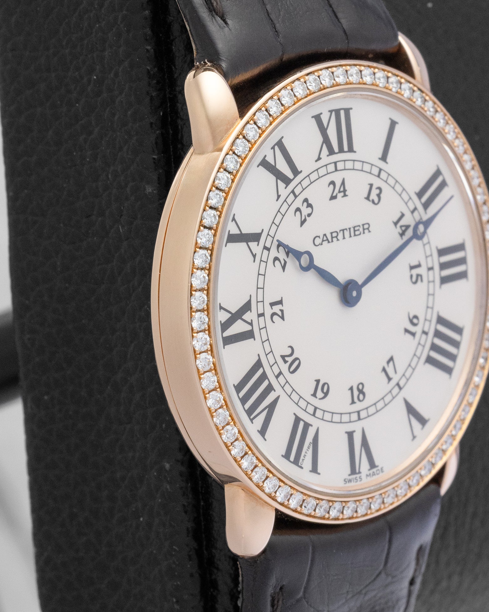 Left profile view of the ultra-thin 18k rose gold case on a Cartier Ronde Louis luxury watch