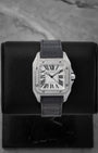 Cartier Santos 100 Medium watch featuring a custom diamond-set pave case diamond bezel and classic silver Roman numeral dial