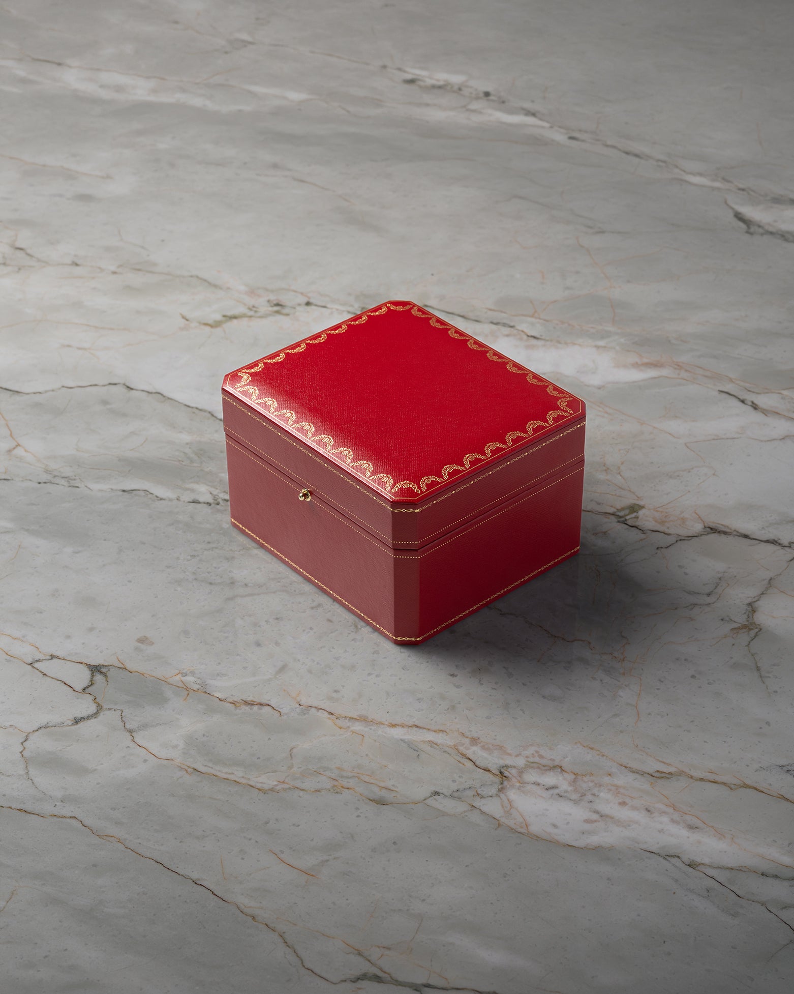 Original iconic red Cartier presentation watch box available at Noah's Fine Watches & Jewelry in Dallas, TX