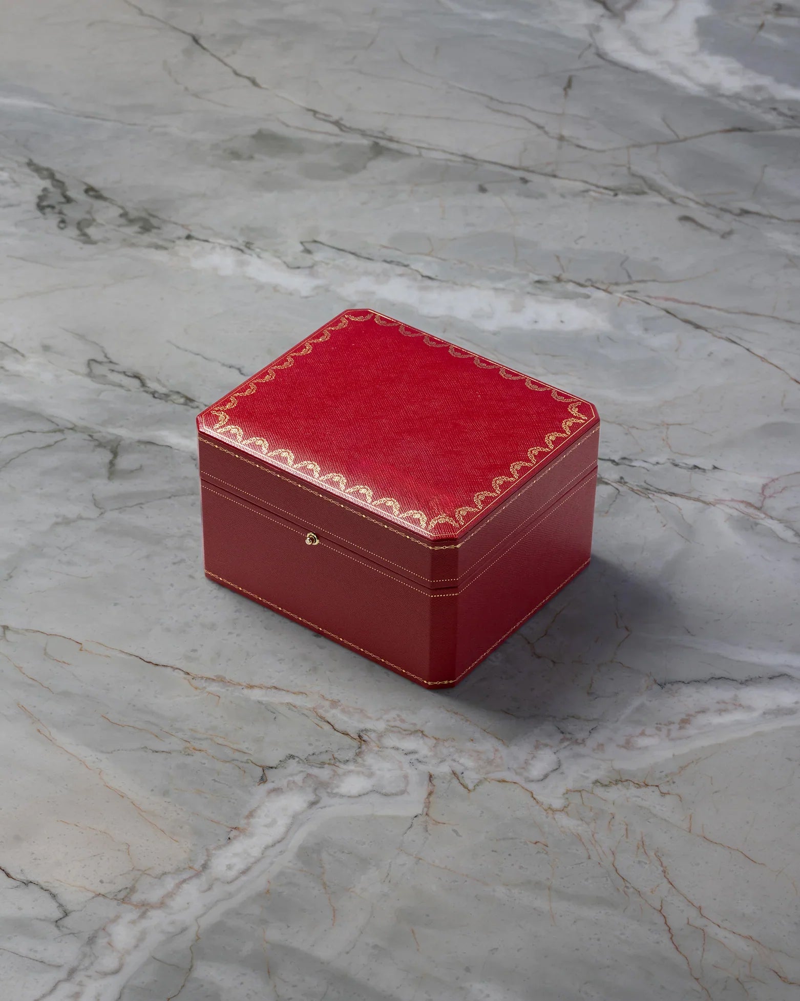 Official iconic red Cartier presentation watch box included with pre-owned Santos de Cartier WSSA0018 at Noah's Fine Watches & Jewelry