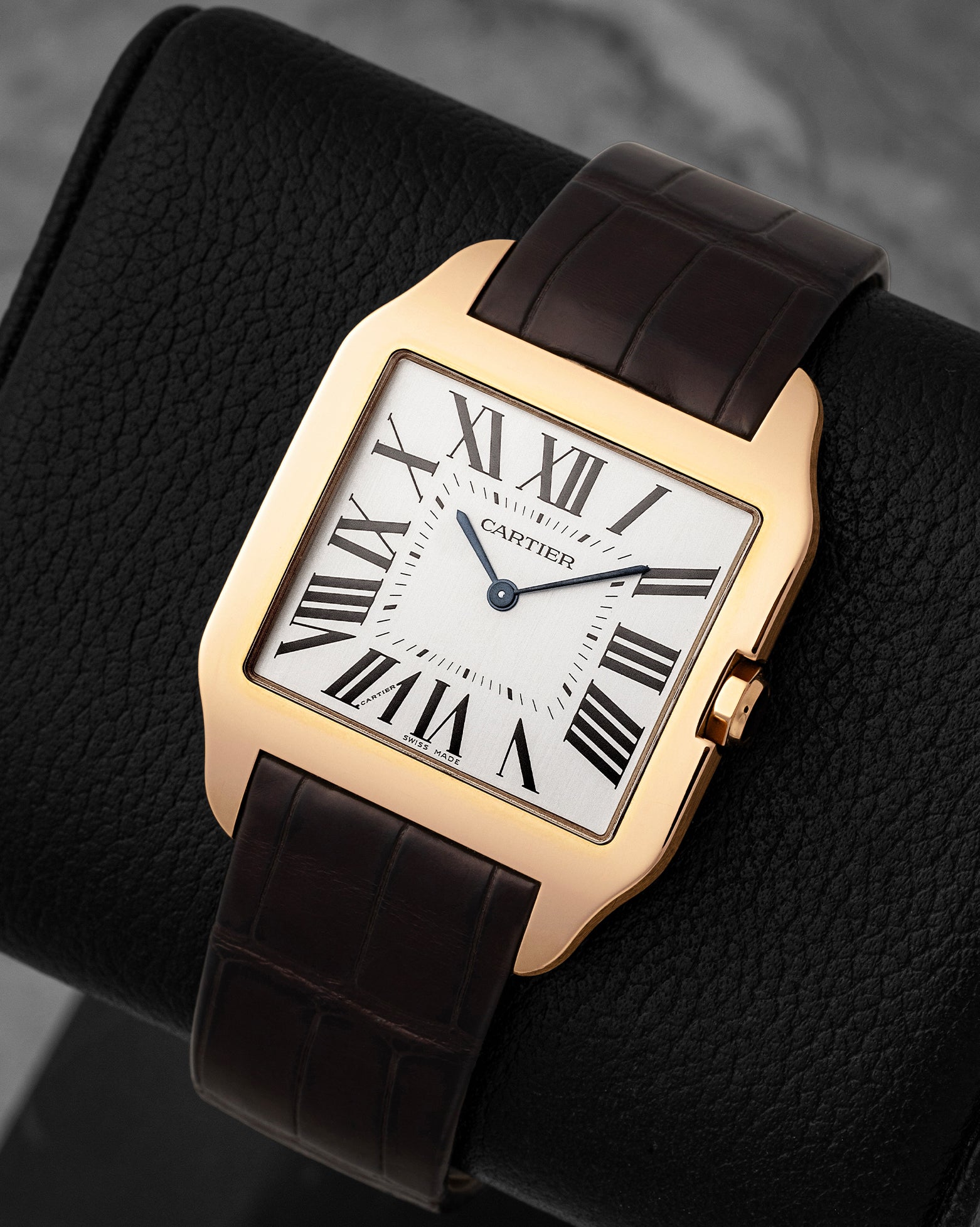 Angled front view of pre-owned Cartier Santos-Dumont reference W2006951 featuring an 18k rose gold bezel, silver dial, and blued-steel hands