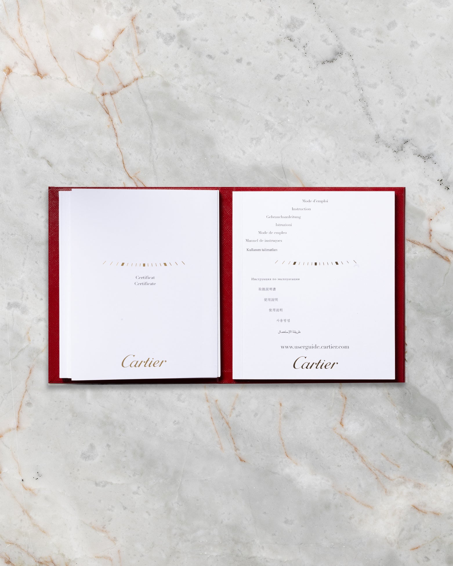 Original Cartier red guarantee certificate booklet included with 2014 Santos-Dumont W2006951 set