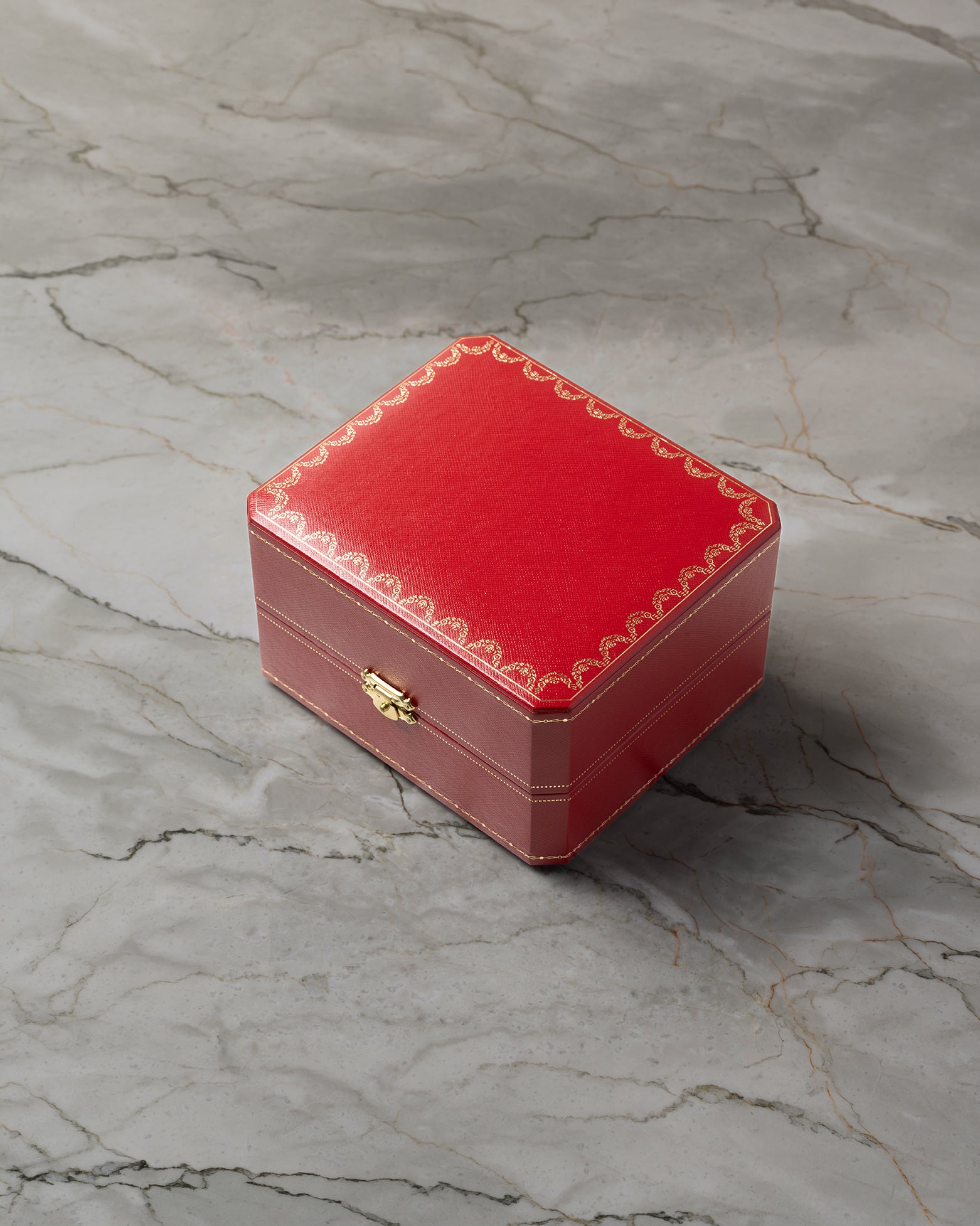 Official red Cartier presentation watch box included with pre-owned Santos-Dumont W2006951 at Noah's Fine Watches & Jewelry