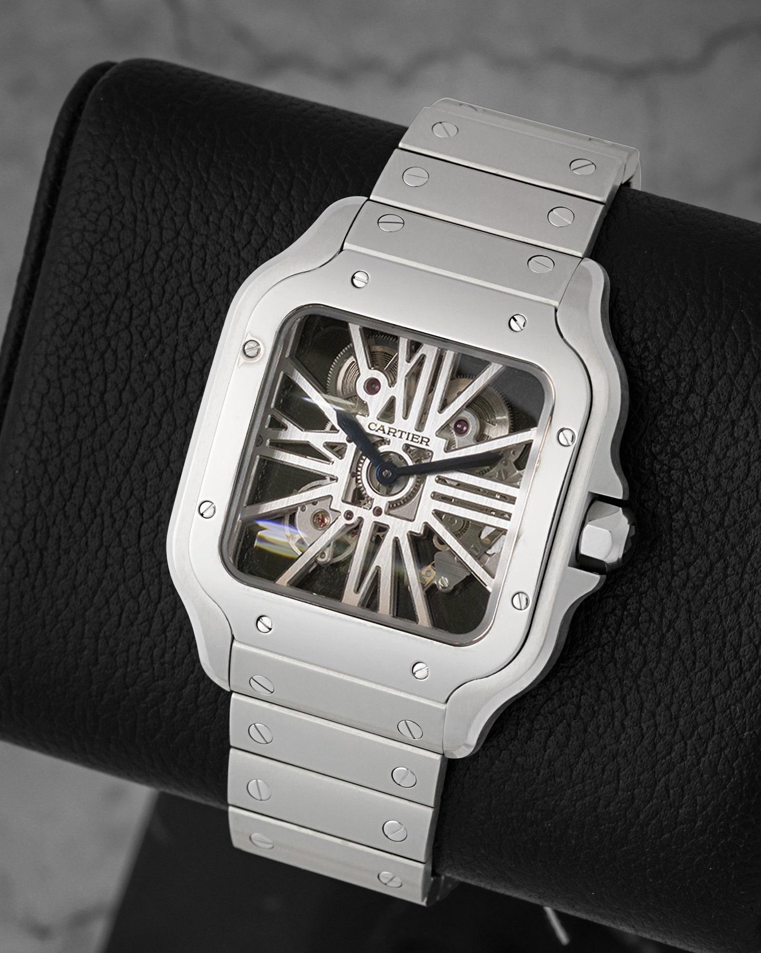 front view of Cartier Santos Skeleton WHSA0015 showing the skeletonized Roman numeral dial and steel bracelet