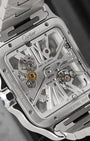 Exhibition sapphire case back view showcasing the manual-wind Calibre 9611 MC movement on a Cartier Santos Skeleton WHSA0015