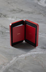 Open red Cartier luxury watch travel pouch included with the pre-owned 2022 Cartier Santos Skeleton