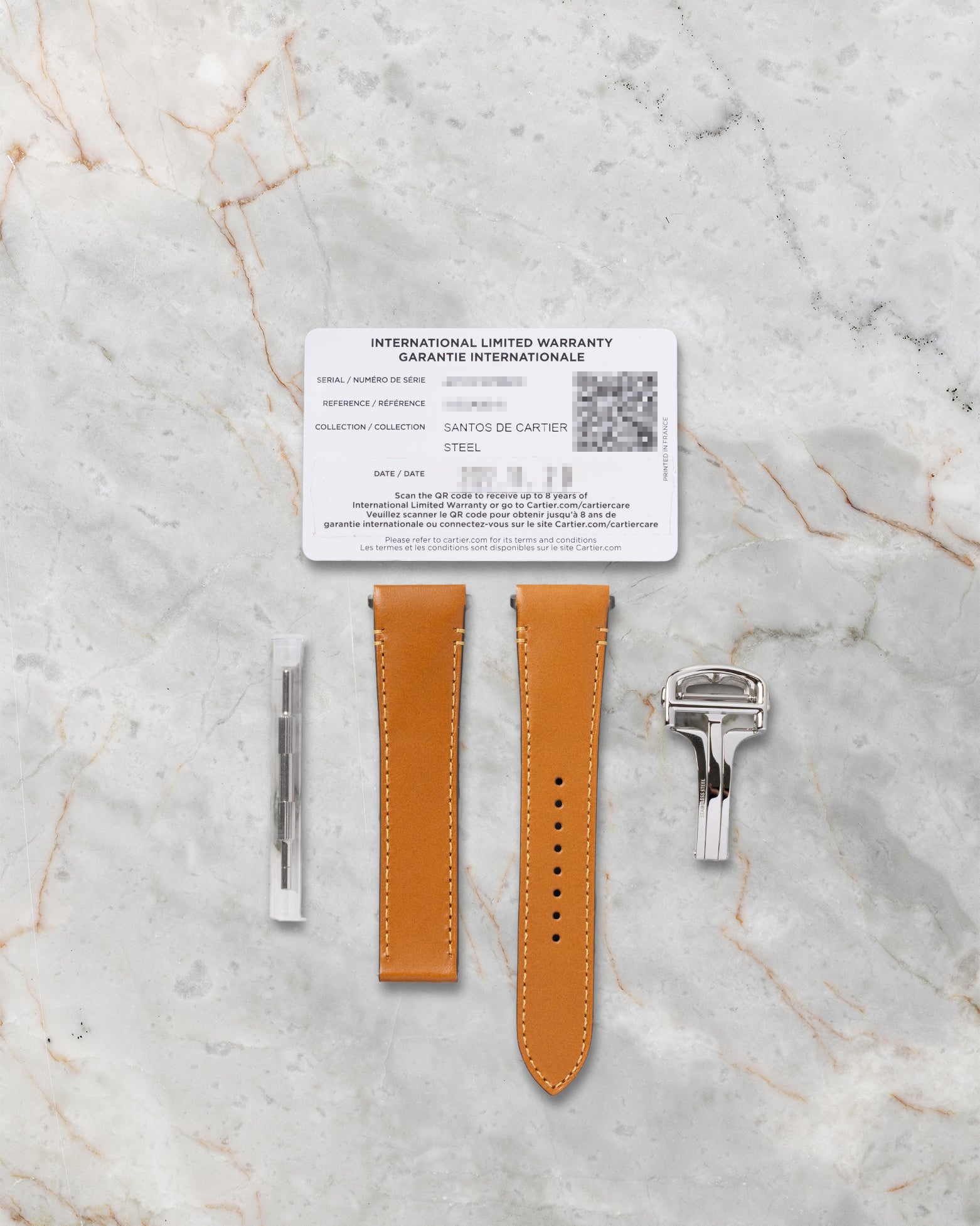 2022 pre-owned Cartier warranty card with QuickSwitch tan calfskin leather strap, folding buckle, and adjustment tool